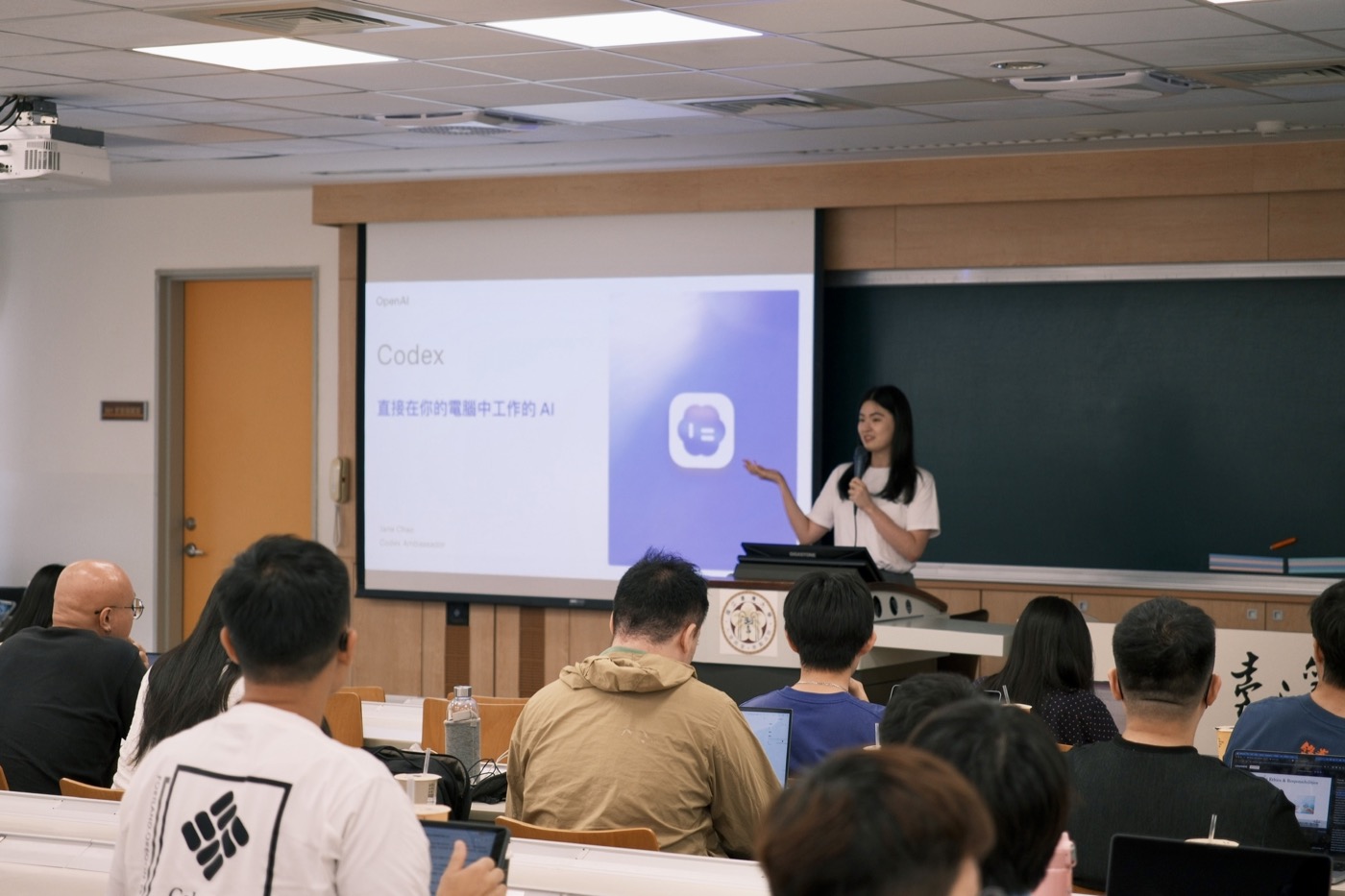 A speaker presenting Codex during a community workshop
